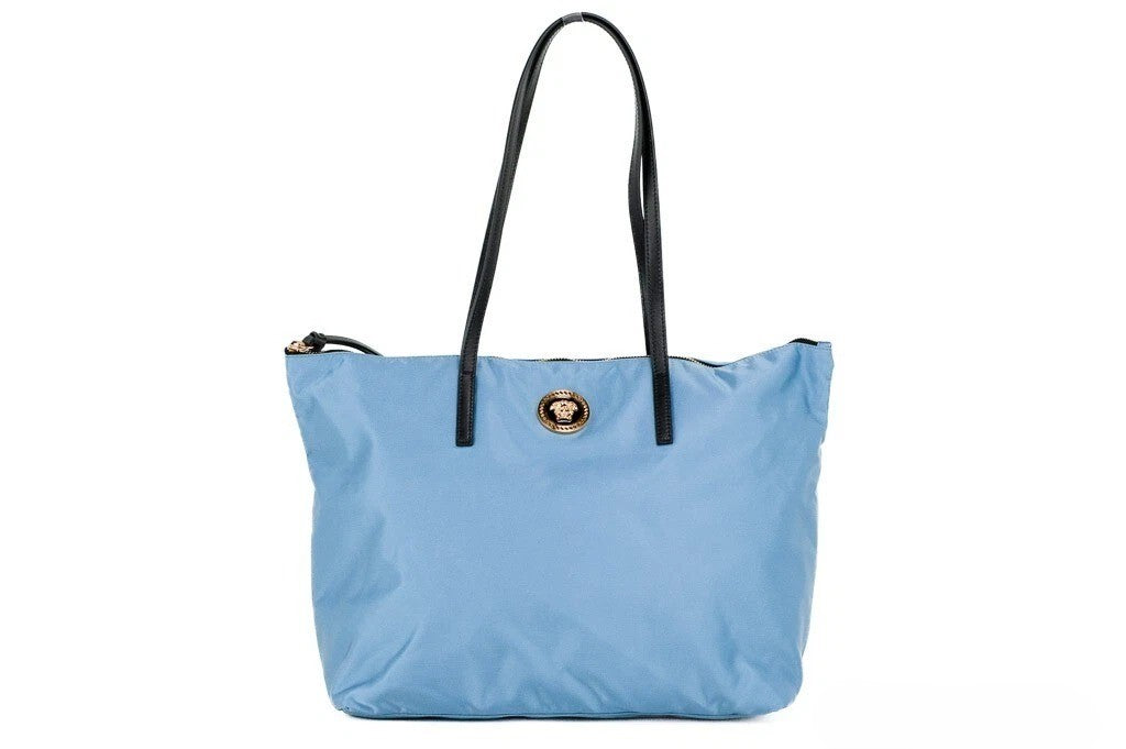 Indulge in the Versace Portuna Medusa Medium Tote Bag, a harmonious blend of durable nylon and luxurious calf leather, designed for those who embrace elegance and sophistication.
