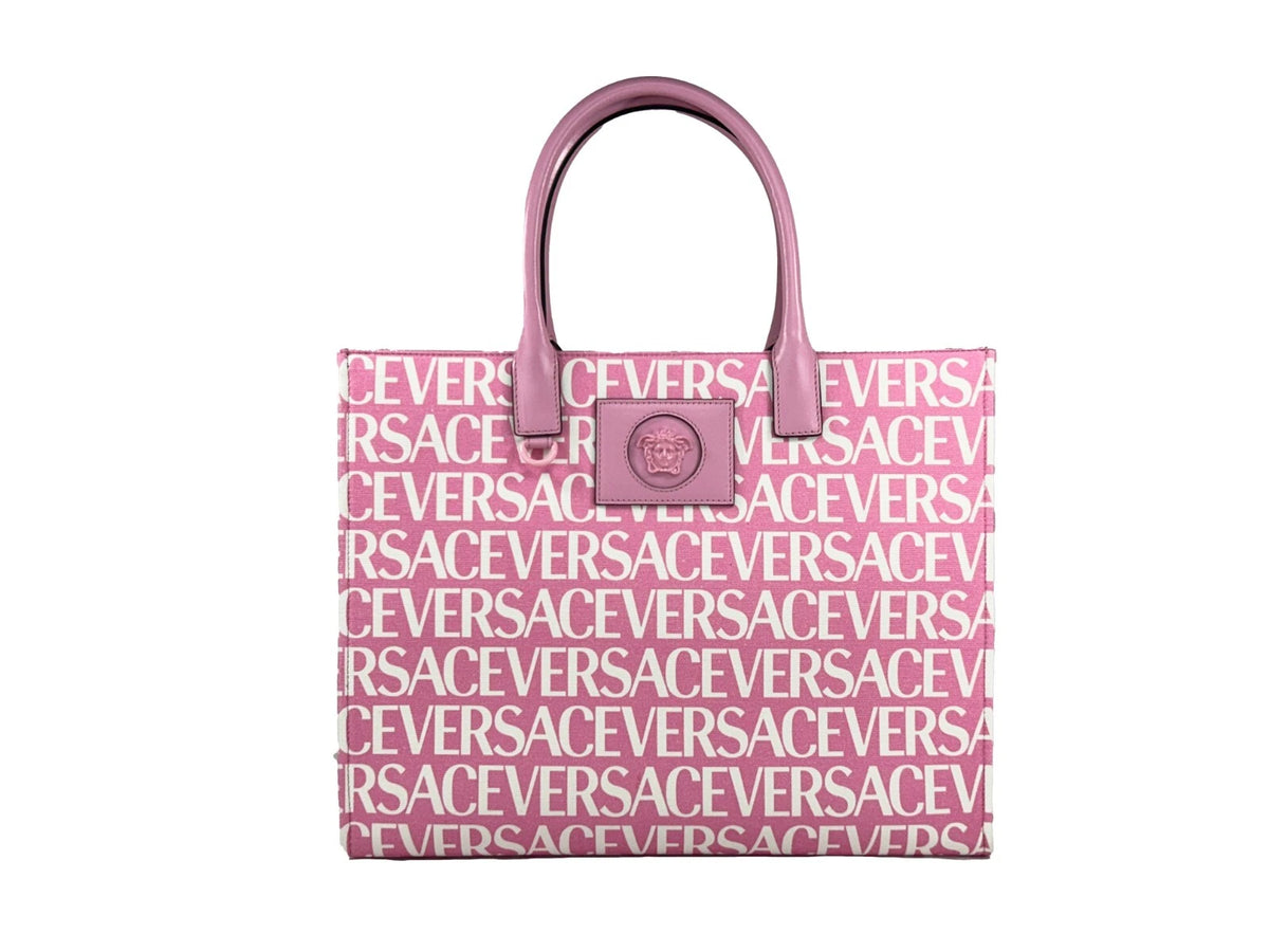 Elevate your style with the Versace Medusa Large Canvas Tote Bag in baby pink, a masterpiece of Italian craftsmanship that embodies luxury and sophistication for every occasion.