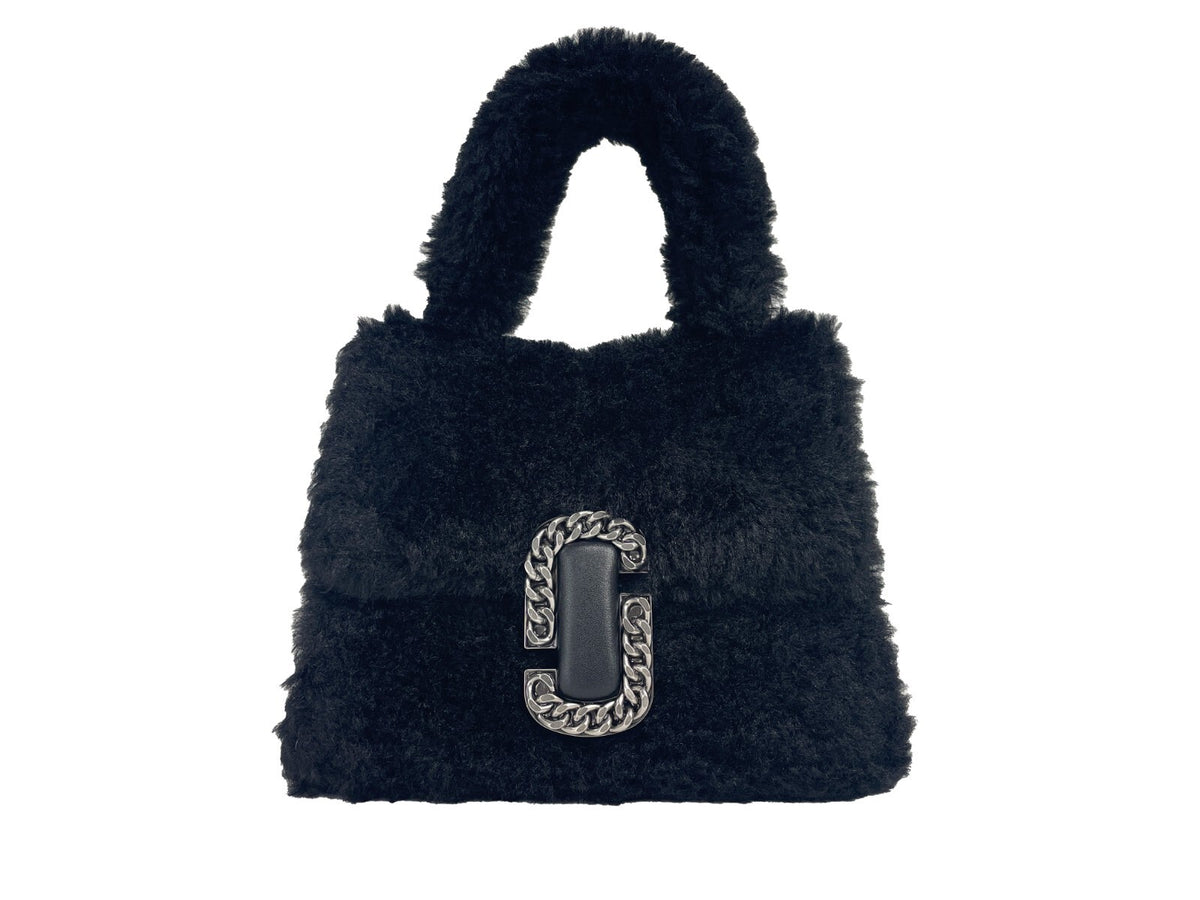 Elevate your style with the Marc Jacobs St Marc Mini Top Handle Satchel, a luxurious fur masterpiece that embodies sophistication and timeless elegance for any occasion.