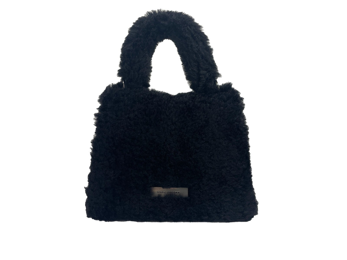 Discover the Marc Jacobs The St Marc Mini Top Handle Satchel, a luxurious fur masterpiece that embodies sophistication and modern versatility for the discerning individual.