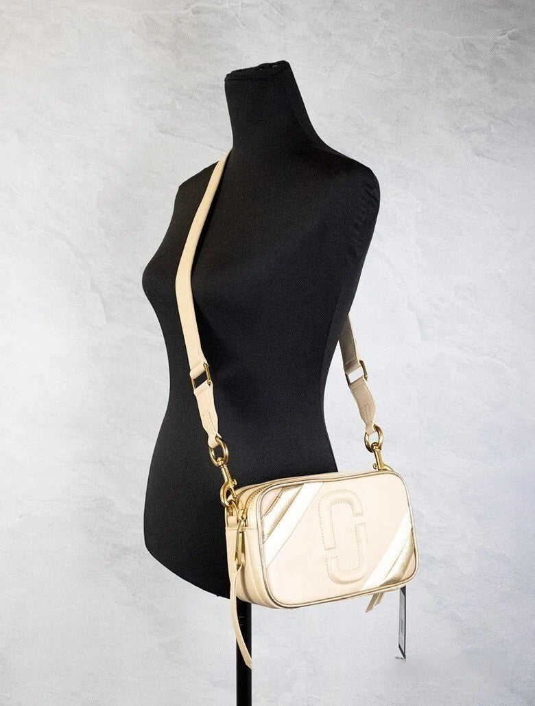 Elevate your style with Marc Jacobs The Moto Shot 21 Curds Leather Camera Crossbody Purse Bag, a masterpiece of craftsmanship in premium leather, designed for the discerning individual.