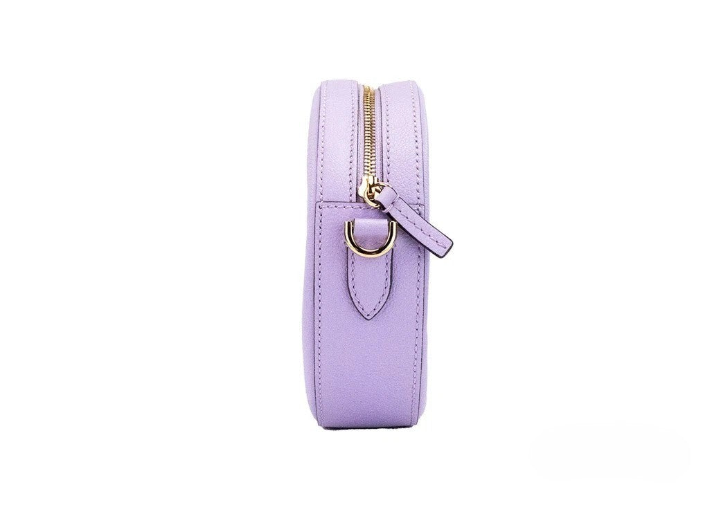 Elevate your style with the Versace Round Disco Lilac Pebbled Leather Camera Case, a luxurious blend of elegance and functionality, crafted in Italy for the discerning individual.