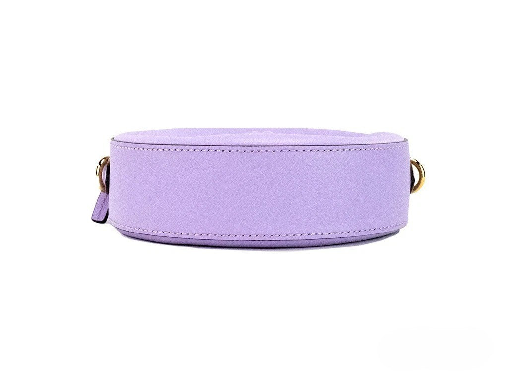 Indulge in the exquisite Versace Round Disco Lilac Pebbled Leather Camera Case, a symbol of luxury and elegance, perfect for elevating any ensemble with its sophisticated design and meticulous craftsmanship.