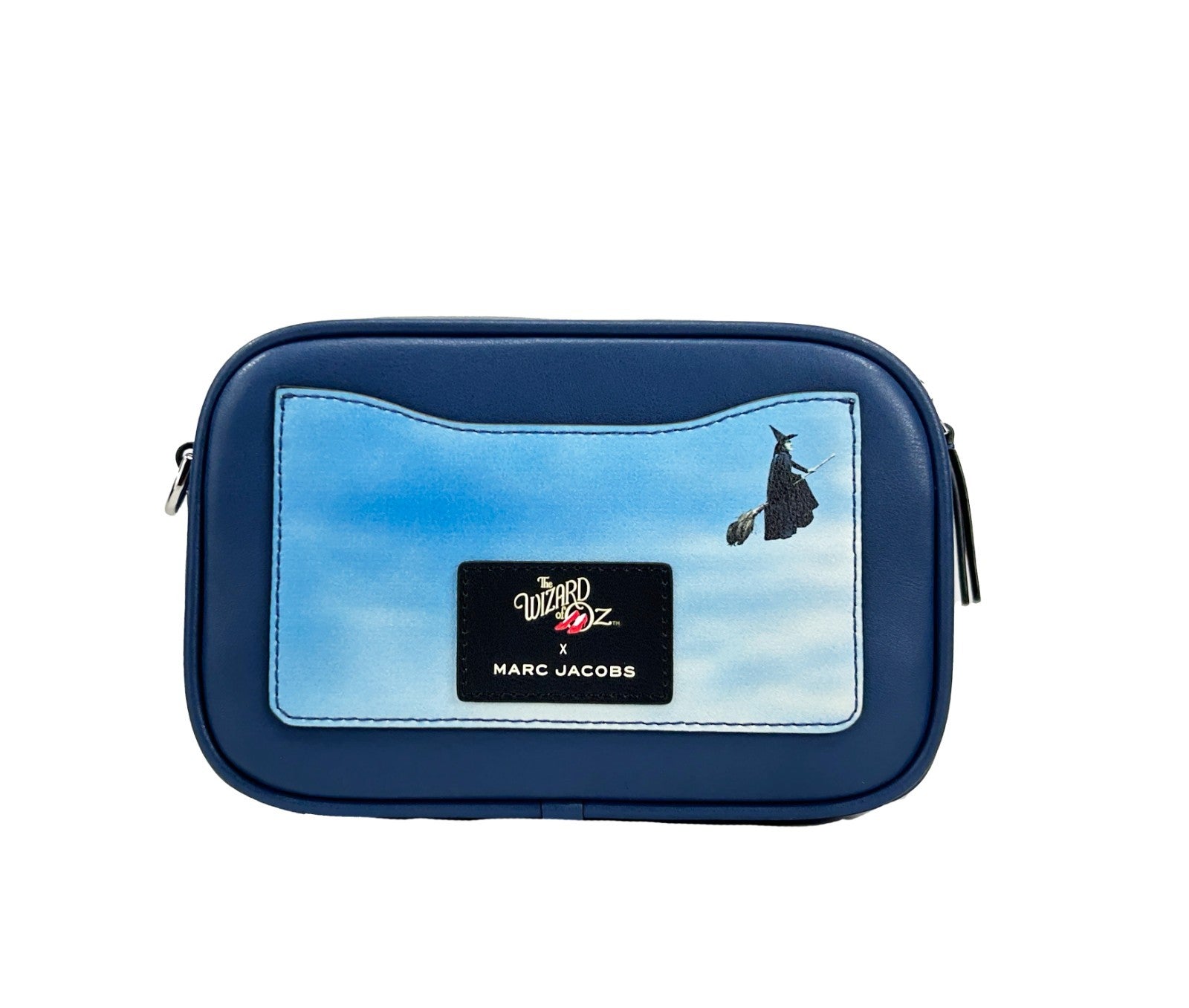 Indulge in the Marc Jacobs Flash Wizard Of Oz Surrender Camera Bag, a masterpiece of premium leather, where whimsical elegance meets modern sophistication for the discerning individual.