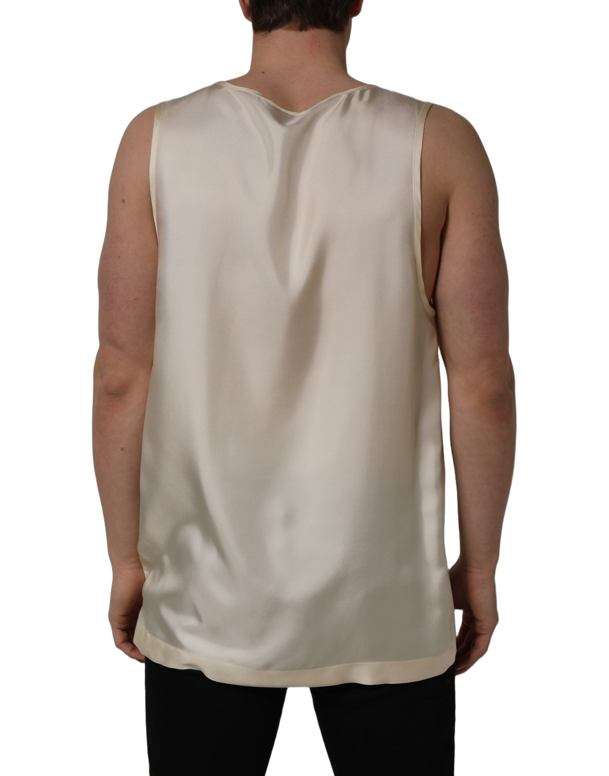 Experience the exquisite allure of Dolce & Gabbana's off-white silk sleeveless tank, a timeless piece that embodies luxury and sophistication, crafted in Italy.
