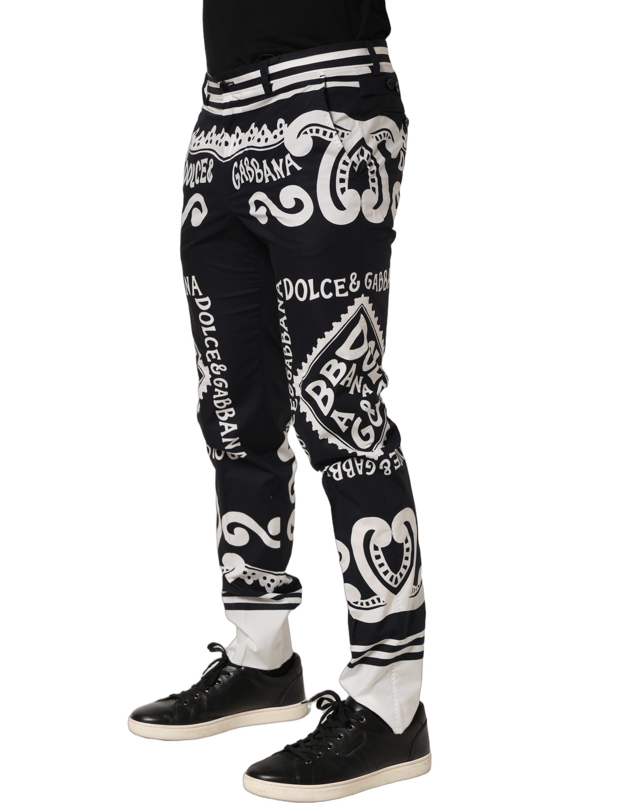 Experience the allure of Dolce & Gabbana's Black Cotton Poplin MarinaPrint Trouser Pants, where exquisite Italian craftsmanship meets timeless sophistication for the discerning individual.