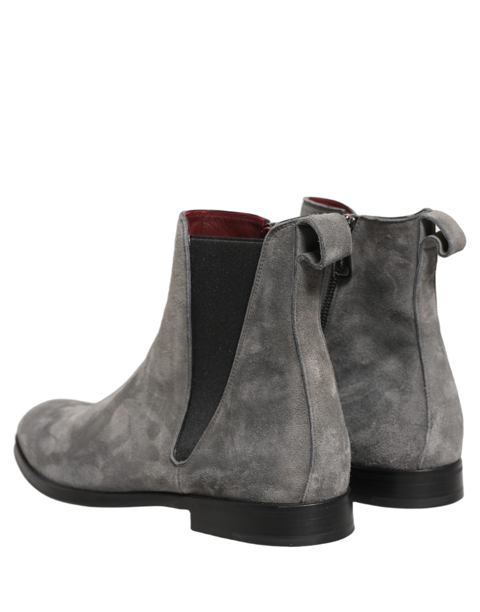 Step into unparalleled elegance with Dolce & Gabbana's Gray Suede Leather Chelsea Boots, a masterpiece of Italian craftsmanship that redefines luxury and sophistication.