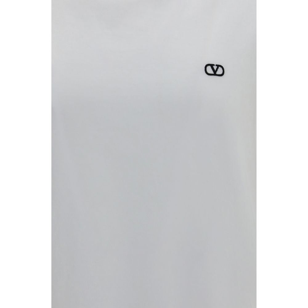 Elevate your wardrobe with the Valentino White Cotton T-Shirt, a masterpiece of 100% cotton craftsmanship, embodying timeless elegance and effortless sophistication.