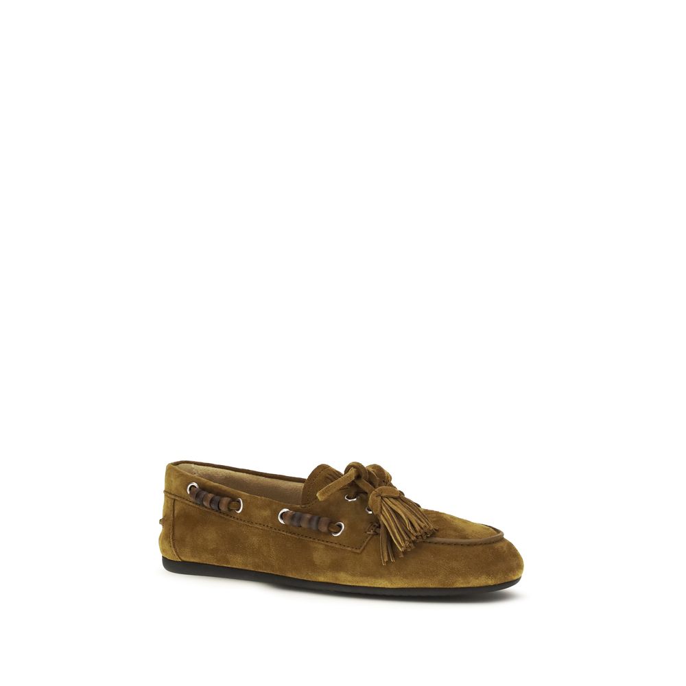 Elevate your style with Miu Miu's Beige Calf Leather Bos Taurus Slip-On Loafers, where luxurious craftsmanship meets timeless elegance for the discerning individual.