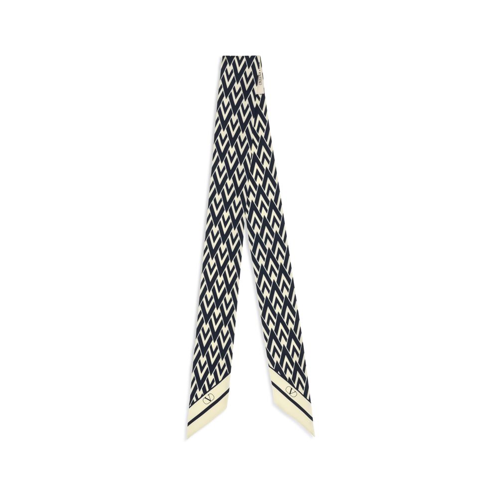 Elevate your style with the Valentino Garavani Blue Silk Scarf from the AW26 collection, a masterpiece of artisanal elegance crafted from 100% silk for timeless sophistication.