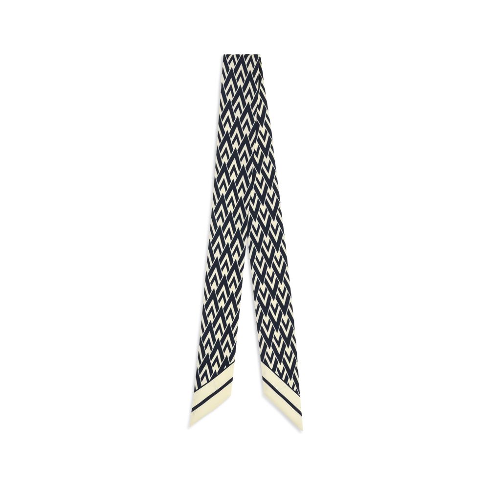 Discover the Valentino Garavani Blue Silk Scarf from the AW26 collection, a masterpiece of 100% silk that embodies artisanal elegance and timeless sophistication.