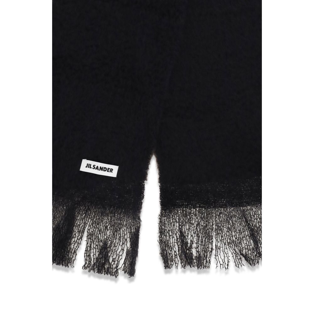 Indulge in the Jil Sander Black Wool Oves Aries Scarf, a masterpiece of 100% Wool Ovis Aries, embodying timeless luxury and sophisticated elegance for every occasion.