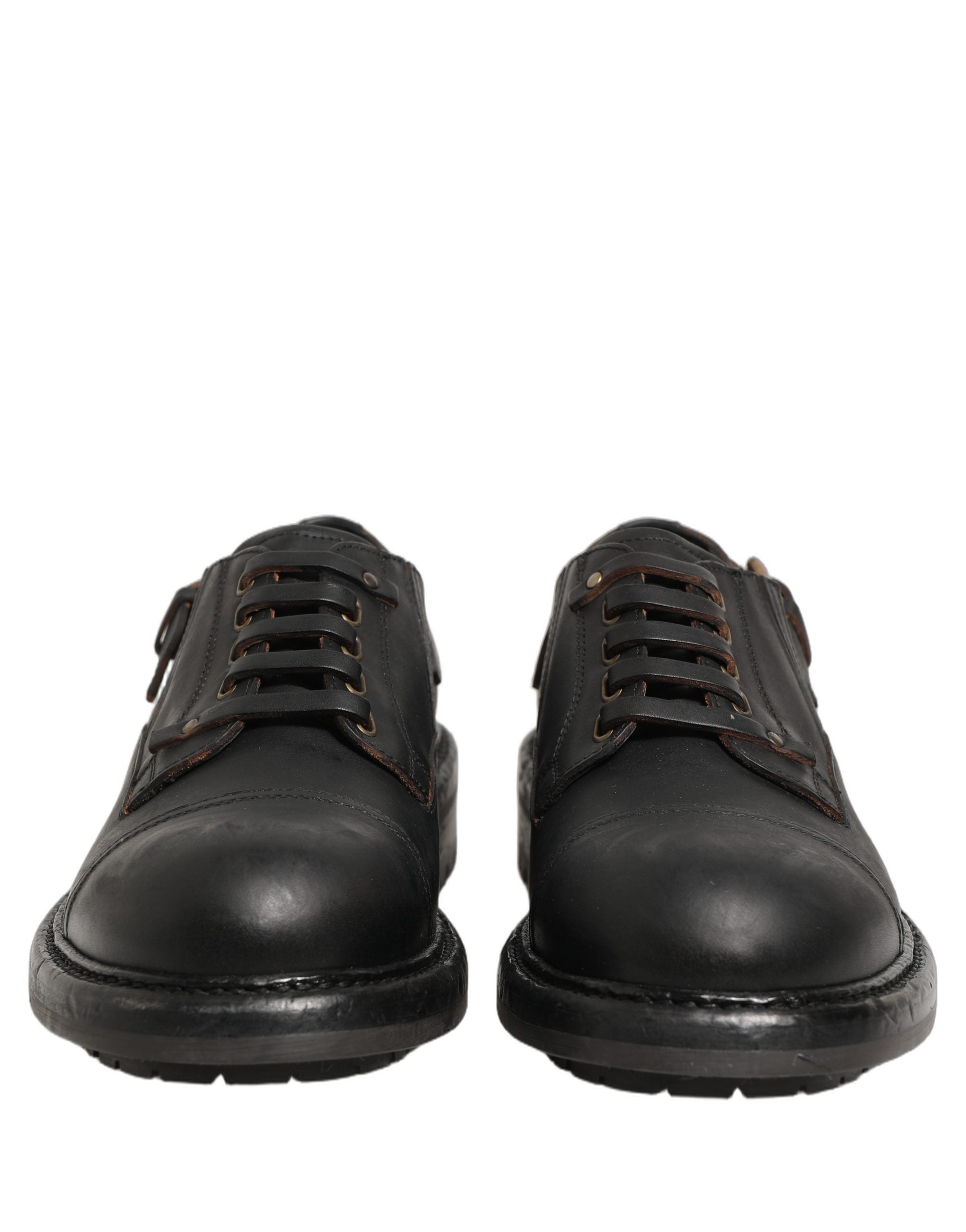 Elevate your style with Dolce & Gabbana's exquisite black leather Derby shoes, a testament to Italian craftsmanship and timeless elegance, perfect for any sophisticated occasion.