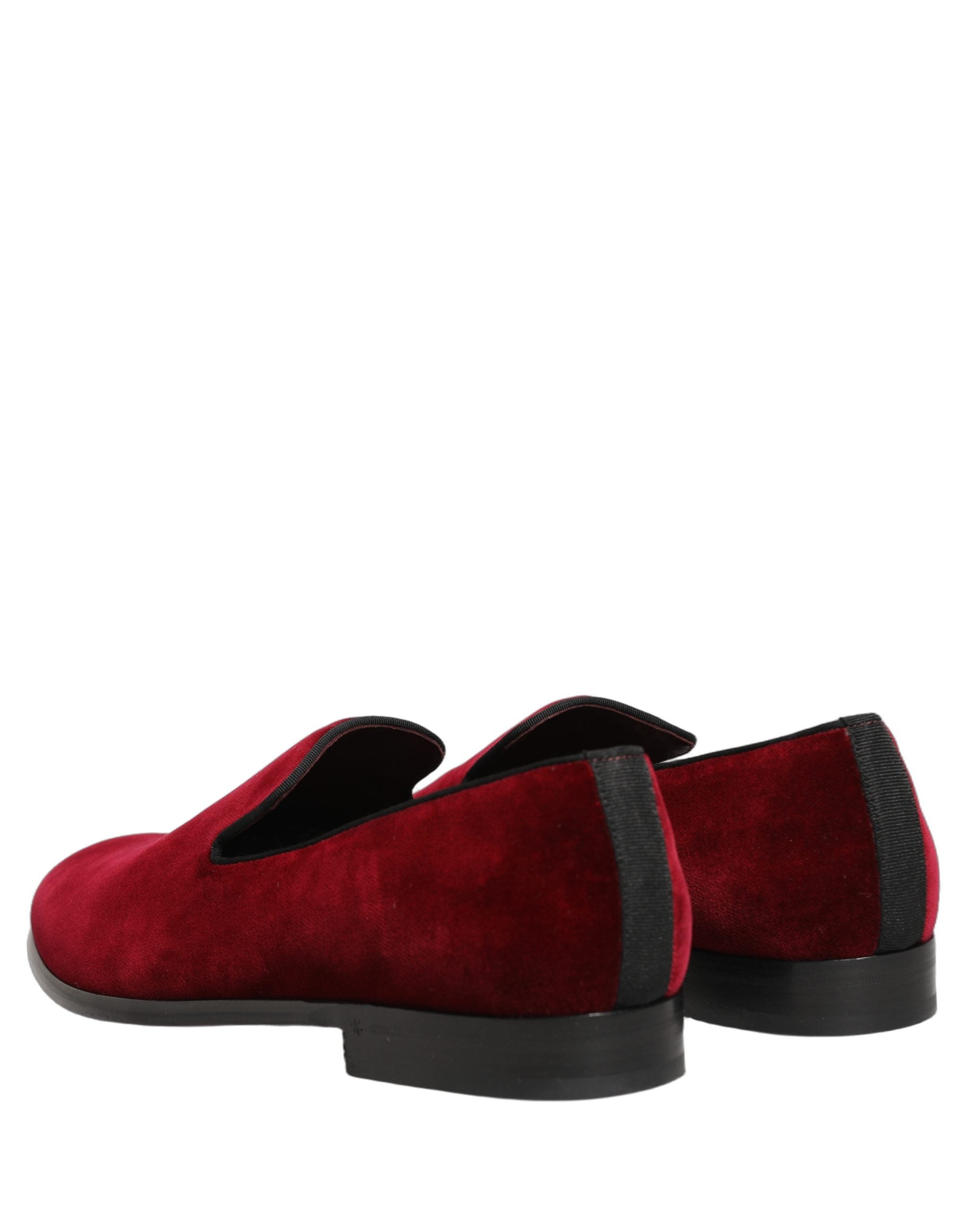 Experience the allure of Dolce & Gabbana's Maroon Velvet Slip On Loafers, where Italian craftsmanship meets luxurious comfort, perfect for the discerning connoisseur.