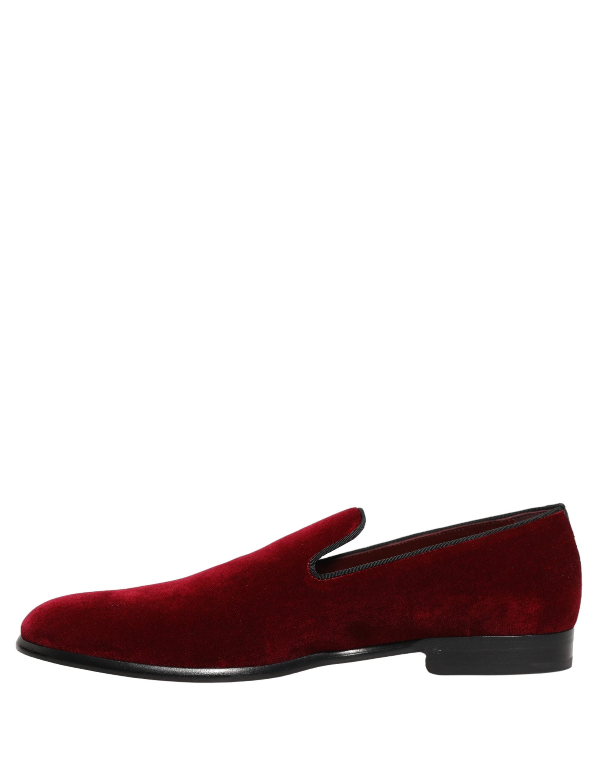 Elevate your elegance with Dolce & Gabbana's Maroon Velvet Slip On Loafers, where Italian craftsmanship meets luxurious comfort, perfect for the discerning connoisseur.