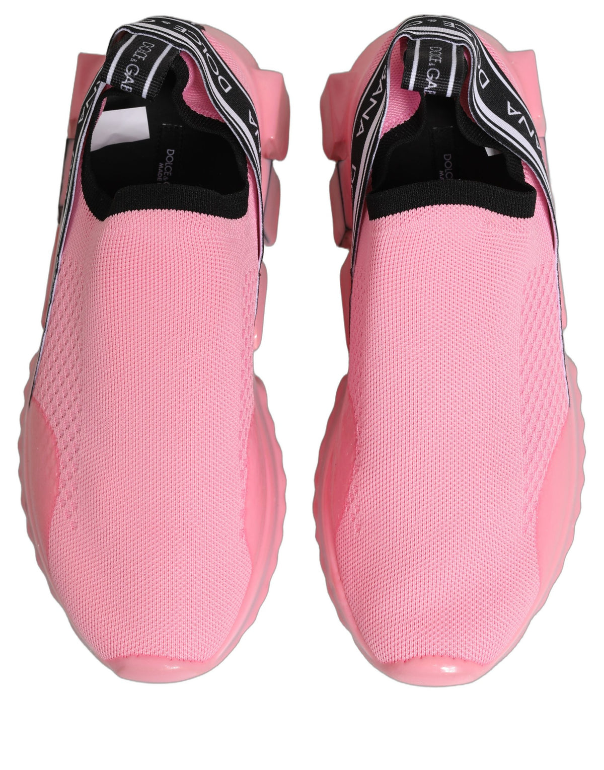 Step into unparalleled elegance with Dolce & Gabbana's Pink Sorrento Sneakers, crafted in Italy from luxurious materials, embodying sophistication and timeless allure.
