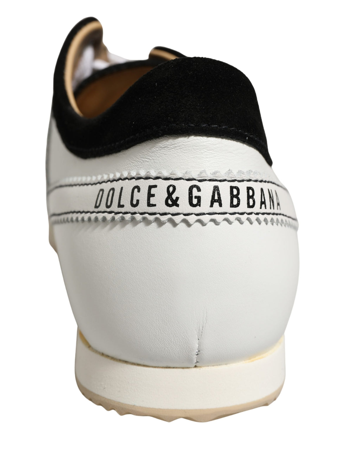 Experience the exquisite allure of Dolce & Gabbana's Black White Leather Suede Low Top Sneakers, a testament to Italian craftsmanship and luxury for the discerning individual.