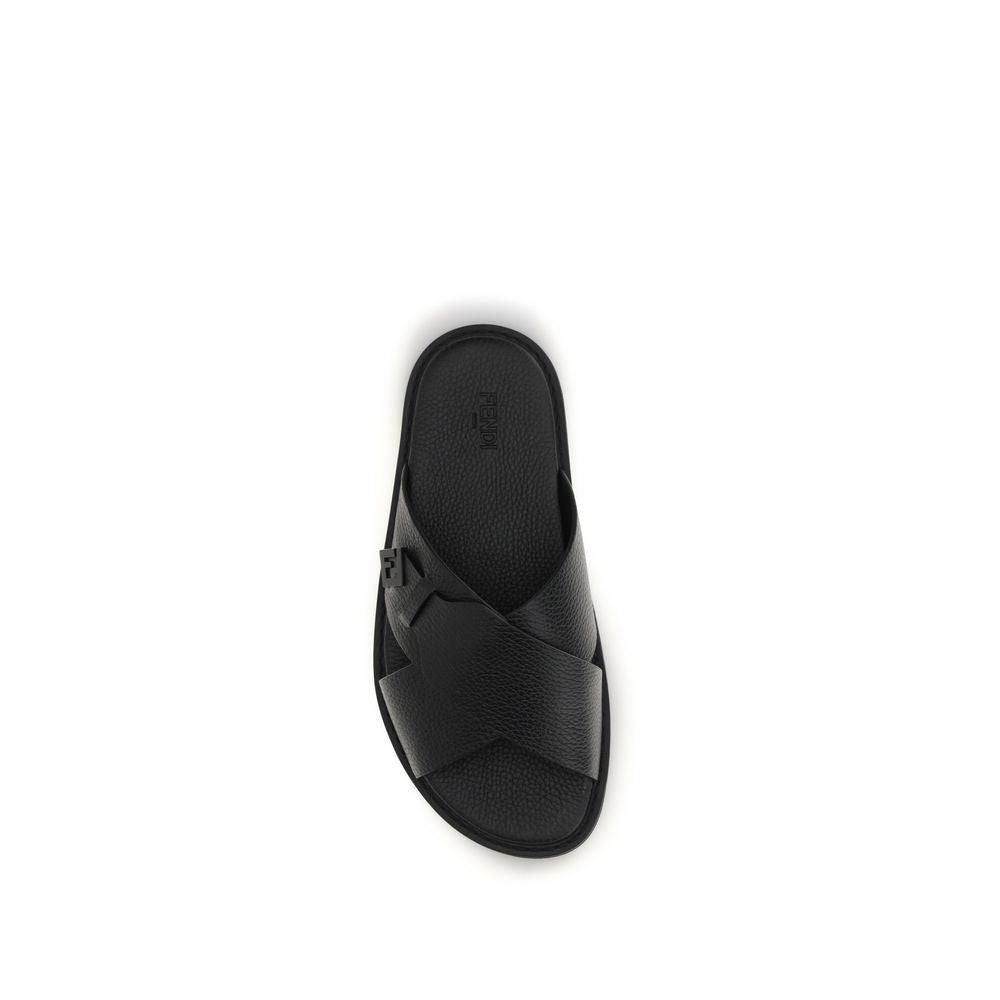 Experience the epitome of luxury with Fendi's Black Calf Leather Bos Taurus Flat Sandals, where exquisite craftsmanship meets timeless elegance for the discerning connoisseur.
