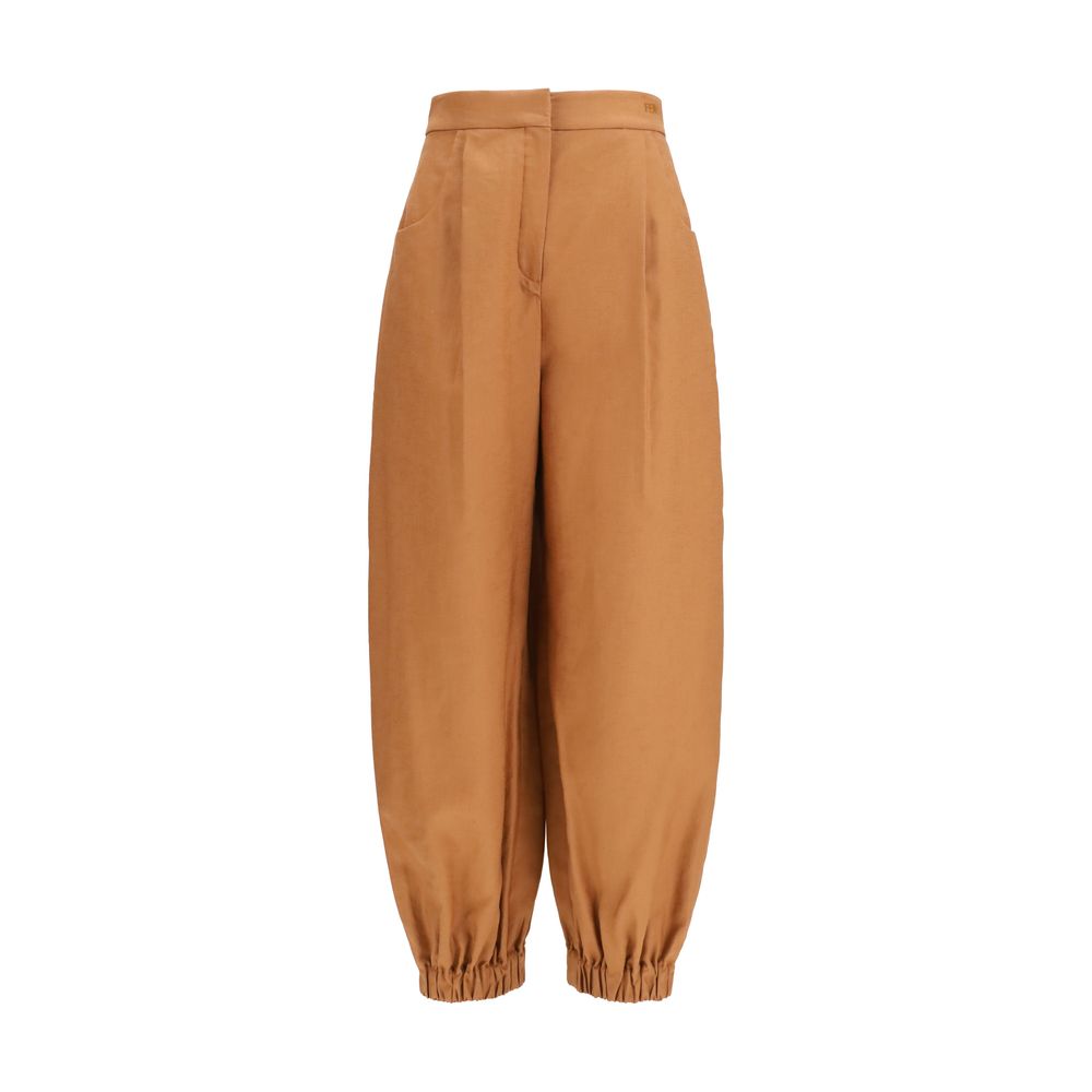 Experience the allure of Fendi Brown Linen Casual Pants, crafted from a luxurious blend of linen and cotton, embodying sophistication and effortless elegance for every occasion.