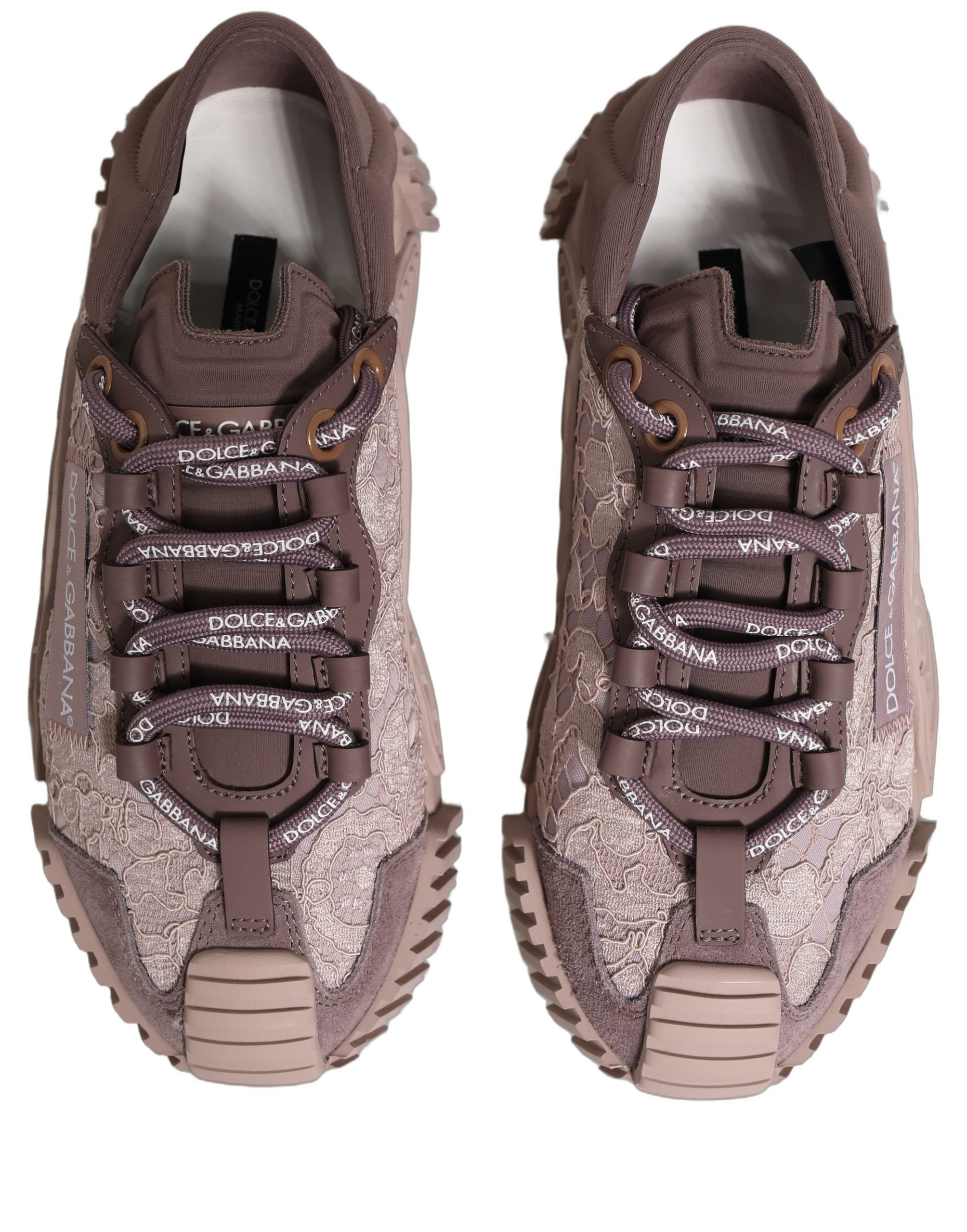 Indulge in the exquisite Dolce & Gabbana Pink Lace NS1 Low Top Sneakers, where luxurious craftsmanship meets vibrant elegance, perfect for the discerning individual.