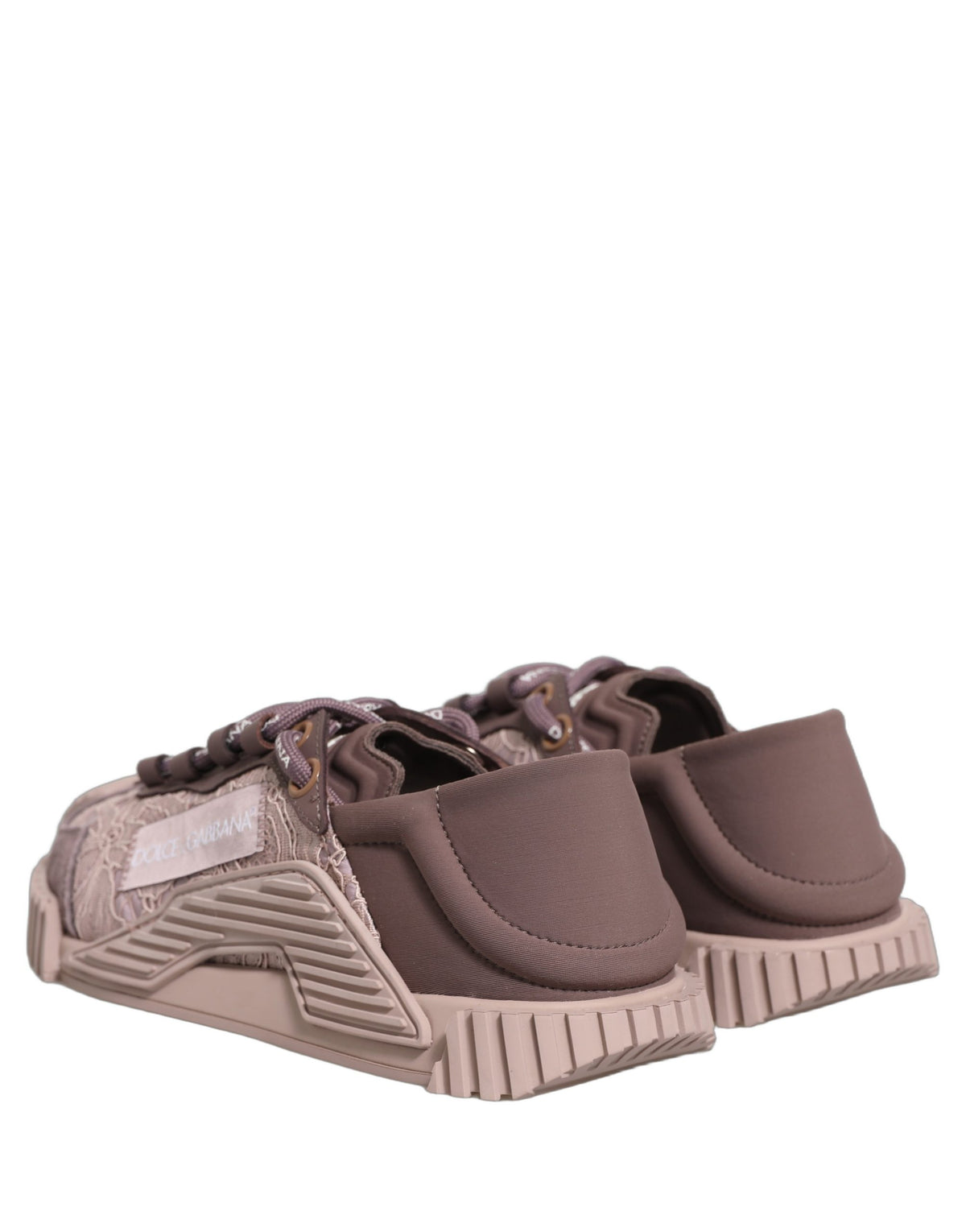 Indulge in the exquisite Dolce & Gabbana Pink Lace NS1 Low Top Sneakers, where luxurious materials meet unparalleled craftsmanship, perfect for the discerning individual.
