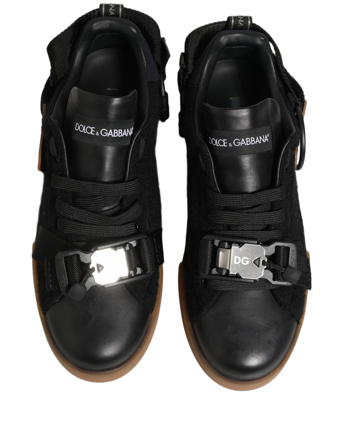 Elevate your style with Dolce & Gabbana's Black Leather Low Trainers, where exquisite Italian craftsmanship meets timeless elegance for the discerning individual.