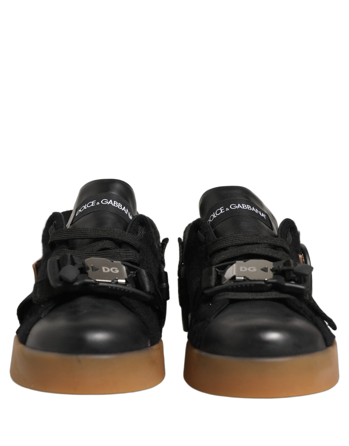Indulge in the exquisite craftsmanship of Dolce & Gabbana's Black Leather Low Trainers, where luxury meets versatility, elevating every occasion with timeless elegance.