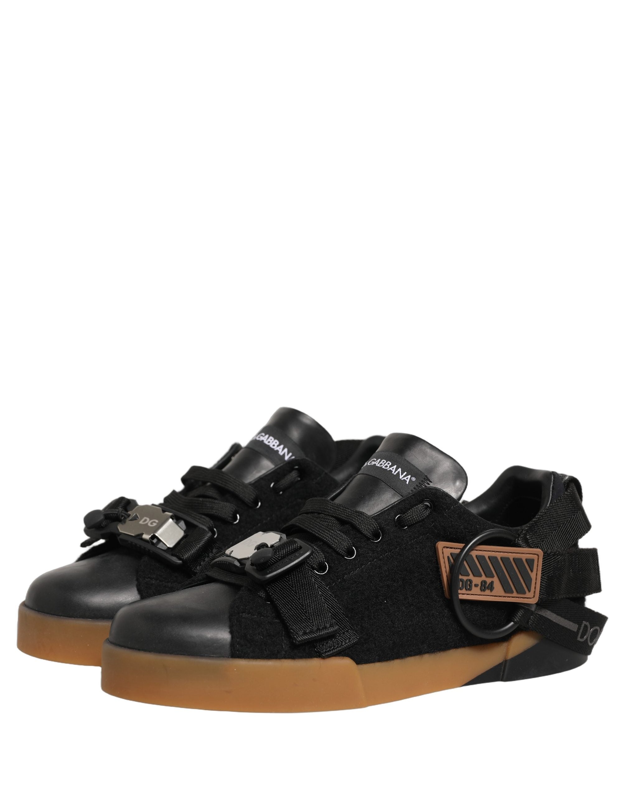 Experience the exquisite craftsmanship of Dolce & Gabbana's Black Leather Low Trainers, where luxury and versatility elevate every moment with timeless elegance.