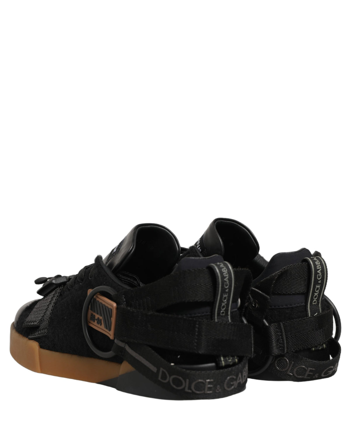 Indulge in the exquisite craftsmanship of Dolce & Gabbana's Black Leather Low Trainers, where luxury and versatility elevate your style for every occasion.