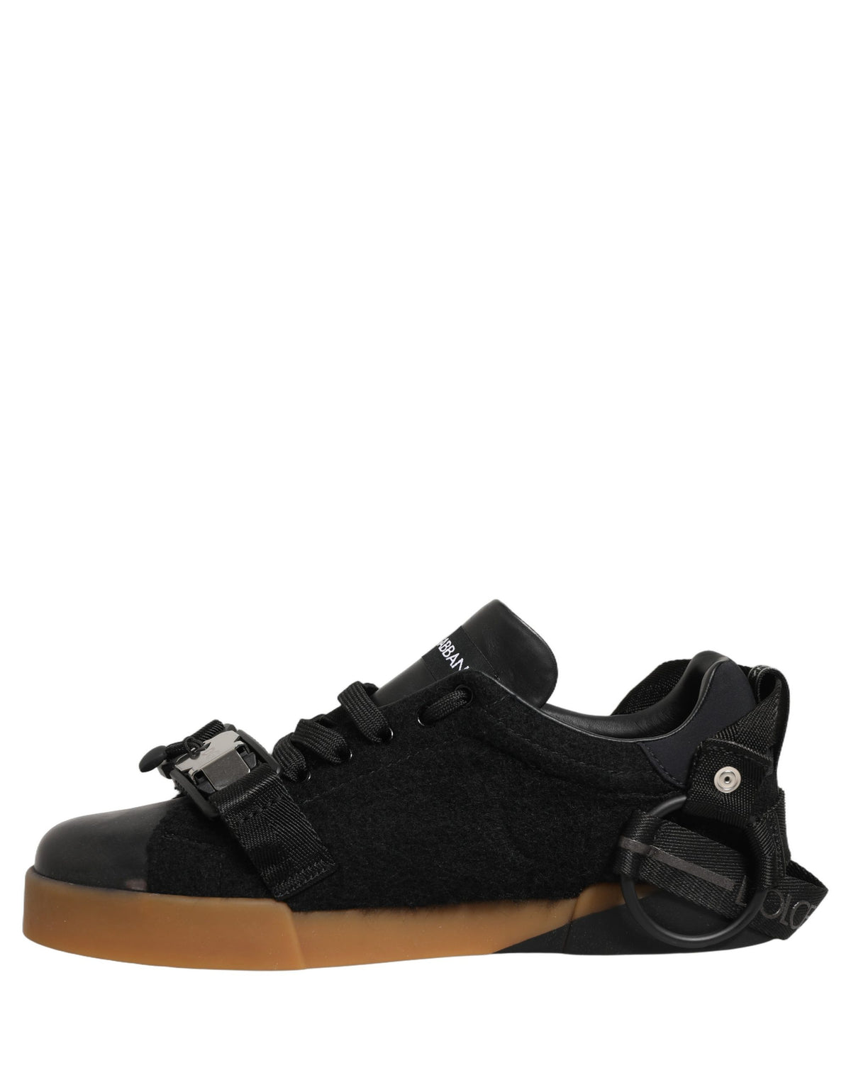 Elevate your style with Dolce & Gabbana's Black Leather Low Trainers, where exquisite Italian craftsmanship meets timeless elegance for the discerning individual.