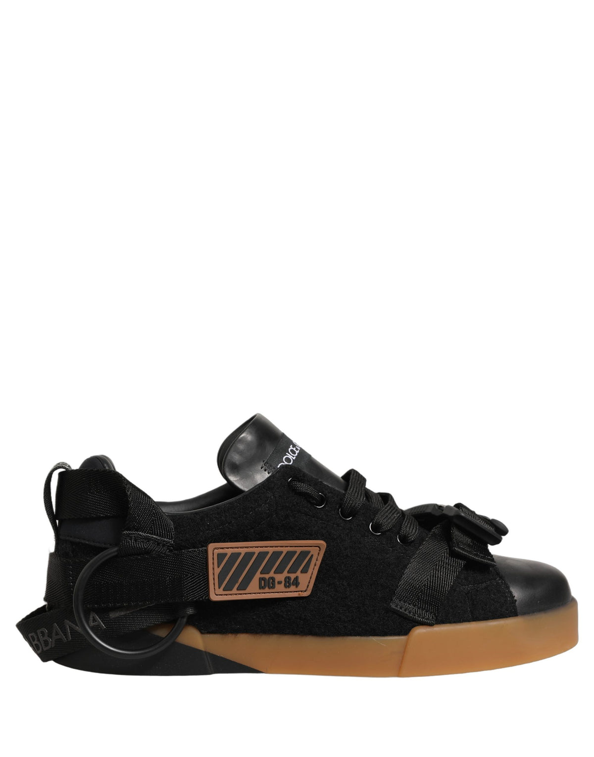 Elevate your style with Dolce & Gabbana's Black Leather Low Trainers, where exquisite Italian craftsmanship meets timeless elegance, perfect for any discerning wardrobe.