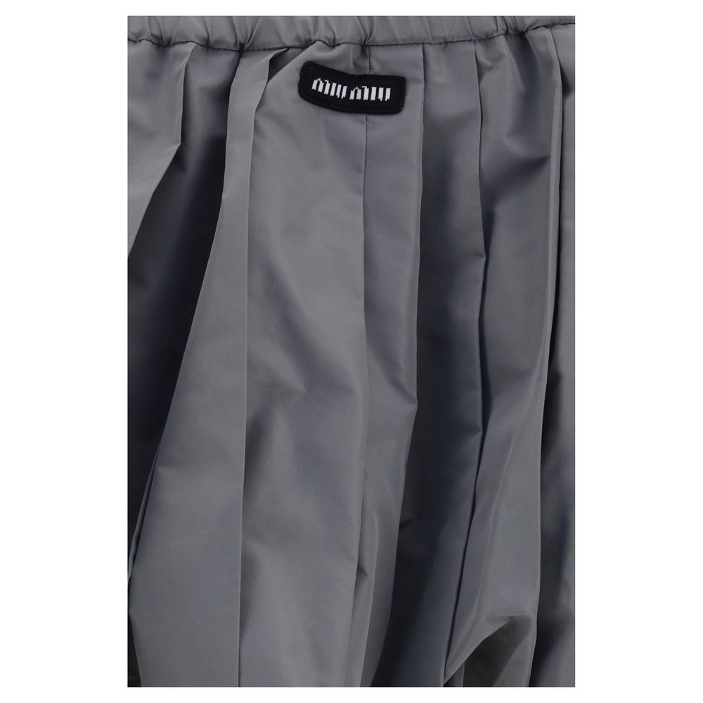 Elevate your wardrobe with the Miu Miu Gray Polyester Mini Skirt, a luxurious blend of modern femininity and timeless elegance, perfect for any sophisticated occasion.