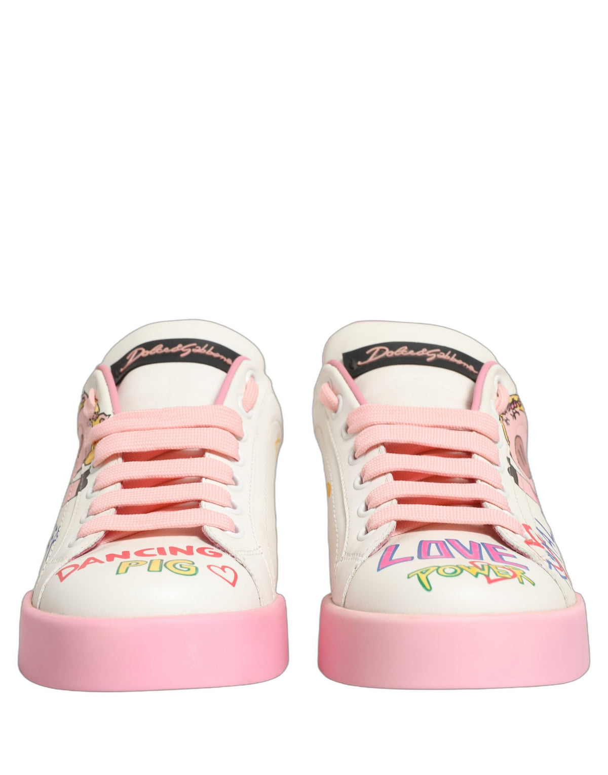 Step into a realm of elegance with Dolce & Gabbana's White Pink Portofino Royal Pig Sneakers, crafted from luxurious calf leather, embodying sophistication and artistry.