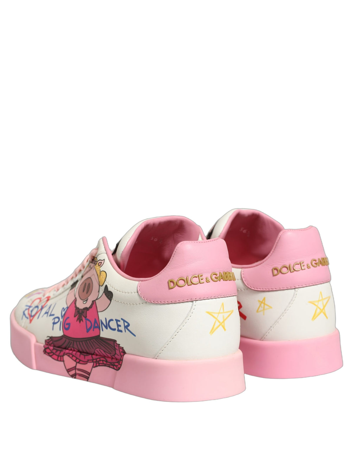 Step into a realm of elegance with Dolce & Gabbana's White Pink Portofino Royal Pig Sneakers, crafted from sumptuous calf leather, embodying luxury and artistry for the discerning individual.