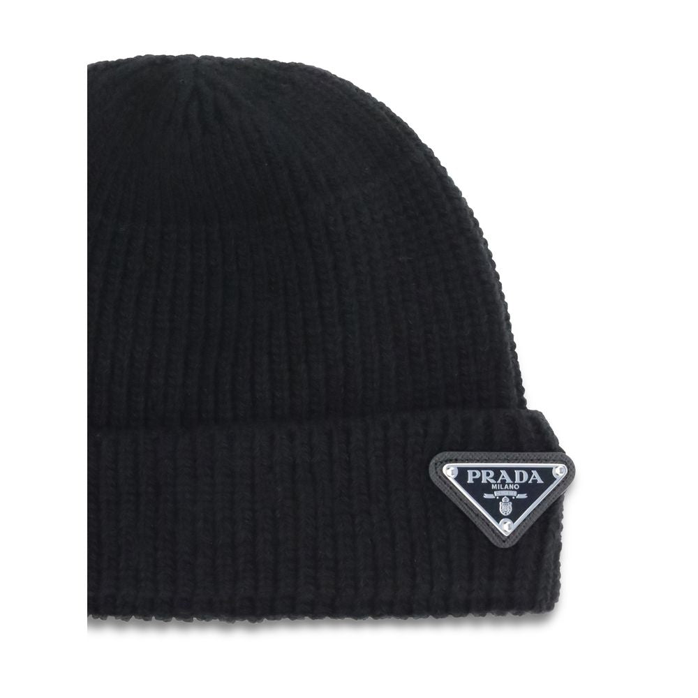 Elevate your winter wardrobe with the Prada Black Wool Oves Aries Beanie, a luxurious blend of fleece wool and cashmere, embodying artisanal urban elegance.