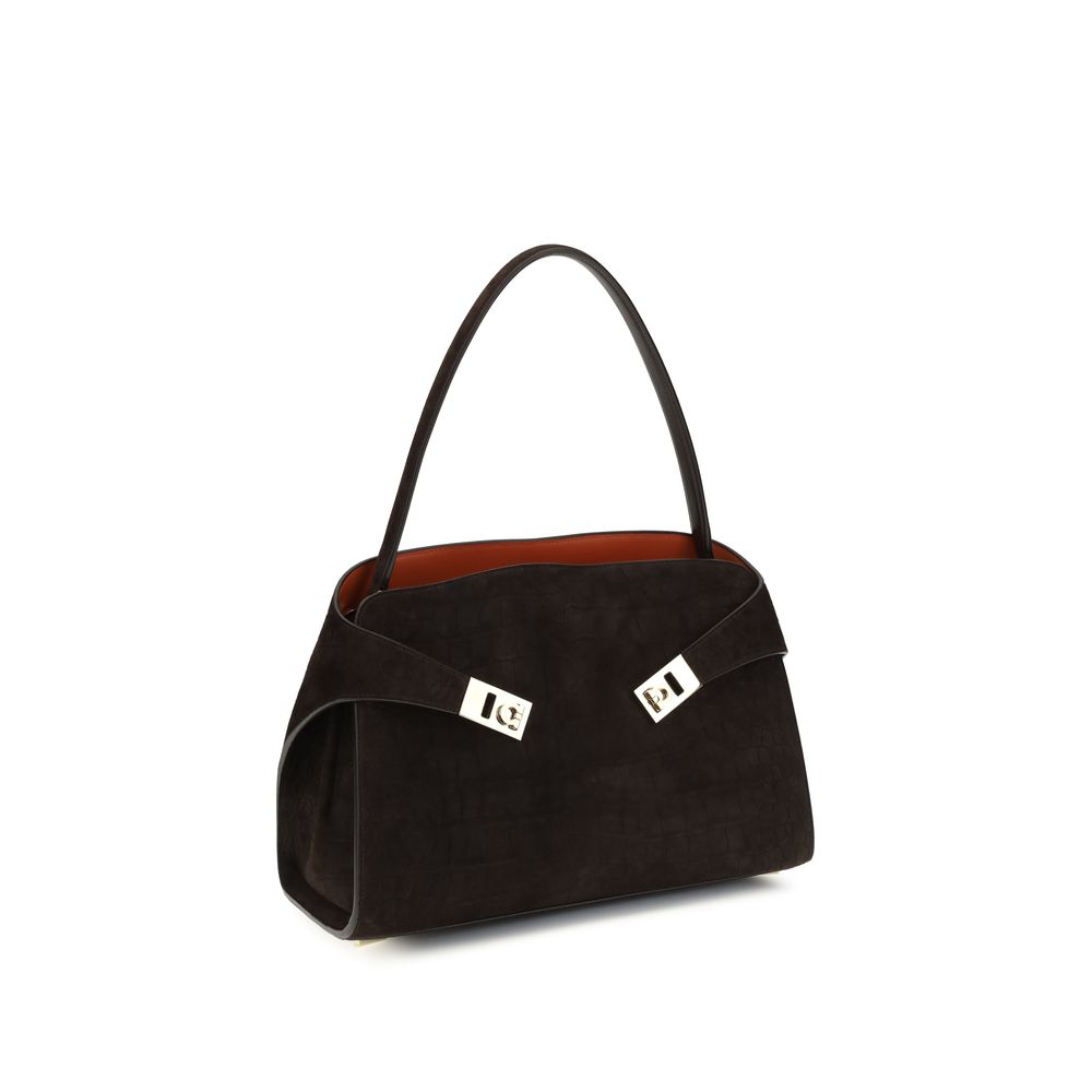 Indulge in the exquisite Ferragamo Brown Calf Leather Bos Taurus Shoulder Bag, a masterpiece of refined suede and gold-tone elegance, perfect for the discerning individual.
