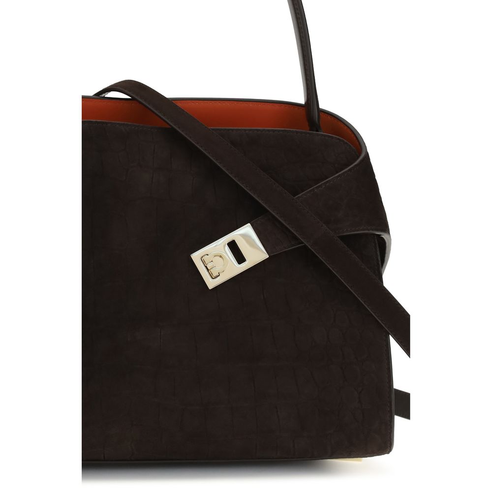 Elevate your elegance with the Ferragamo Brown Calf Leather Bos Taurus Shoulder Bag, a masterpiece of refined suede and gold-tone details, perfect for any occasion.