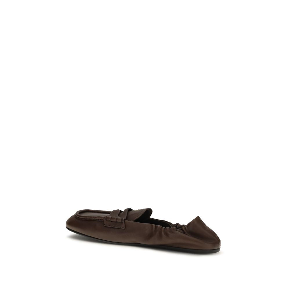 Discover the Miu Miu Brown Lamb Ovis Aries Aries Slip-On Loafers, where exquisite nappa leather meets timeless elegance, embodying luxury and sophistication for every occasion.