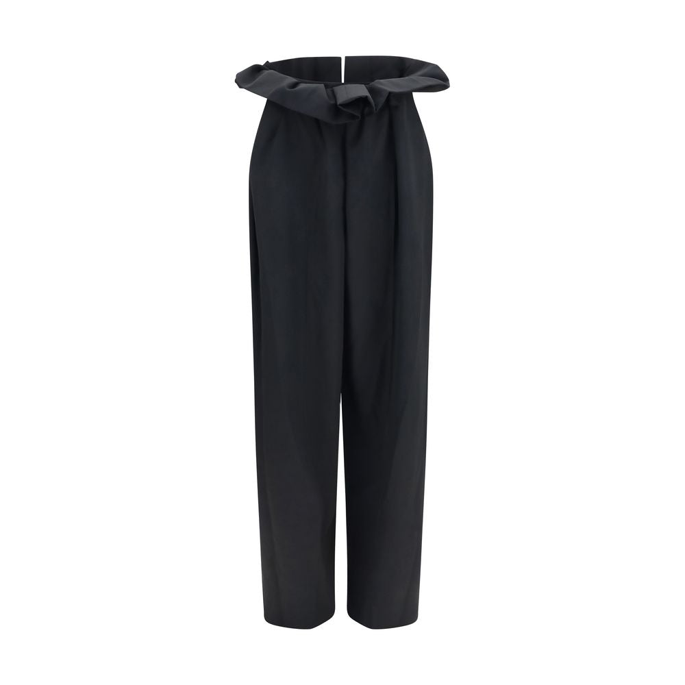 Indulge in the Khaite Black Wool Oves Aries Casual Pants, crafted from 100% Merino Wool for unparalleled elegance and comfort, perfect for the discerning modern connoisseur.