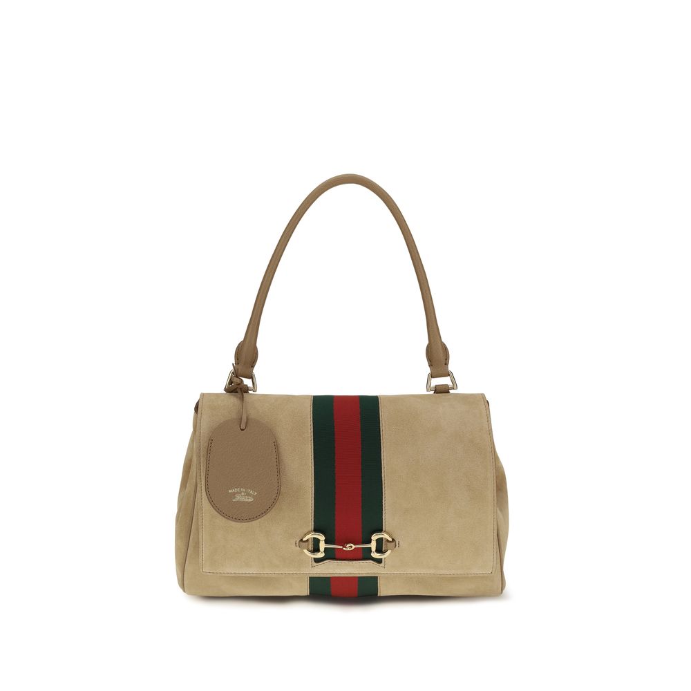Discover the Gucci Beige Calf Leather Bos Taurus Handbag, a symbol of luxury and artistry crafted from soft suede, perfect for elevating any sophisticated ensemble.