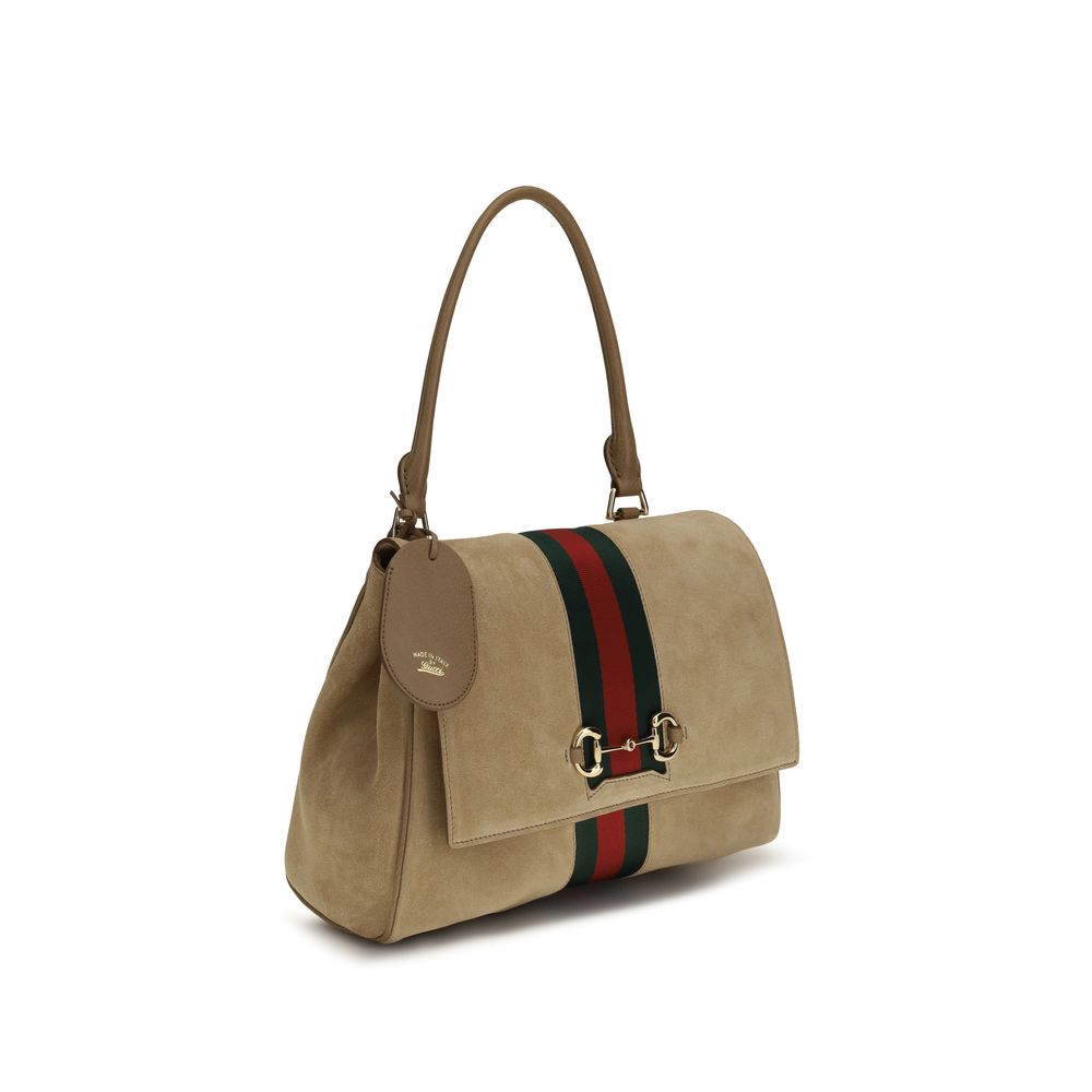 Discover the Gucci Beige Calf Leather Bos Taurus Handbag, a blend of exquisite craftsmanship and timeless elegance, perfect for those who embrace luxury and sophistication.