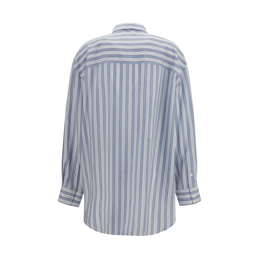 Elevate your wardrobe with the Gucci Blue Silk Shirt from the AW26 collection, crafted in sumptuous silk jacquard, embodying timeless elegance and sophisticated allure.