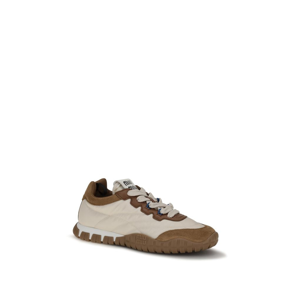 Elevate your style with Miu Miu Beige Polyamide Athletic Sneakers, a harmonious blend of luxe materials and sophisticated design, perfect for the discerning individual.