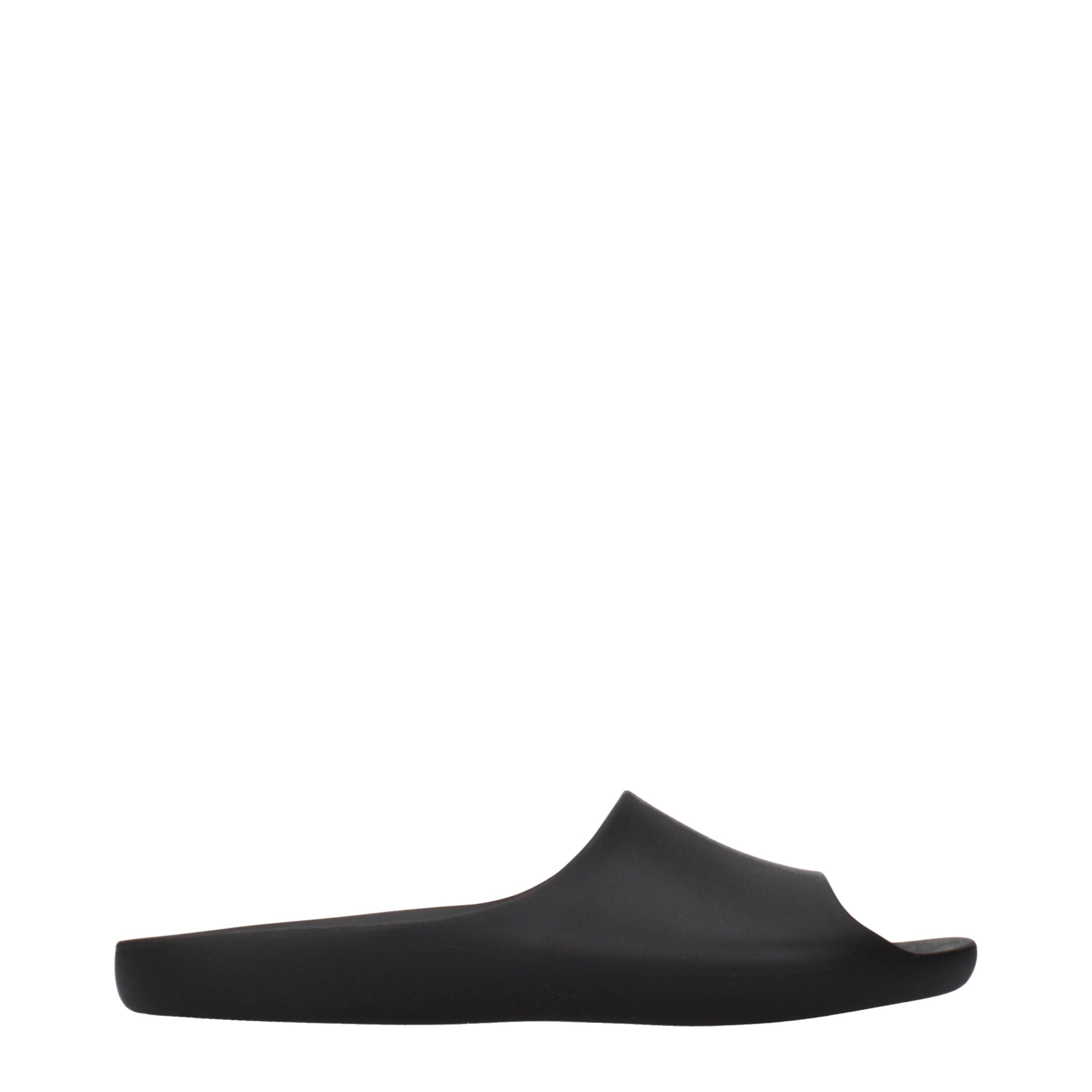 Experience the allure of The Row Black Cotton Slippers, where exquisite craftsmanship meets timeless elegance, inviting you to indulge in luxurious comfort and sophistication.
