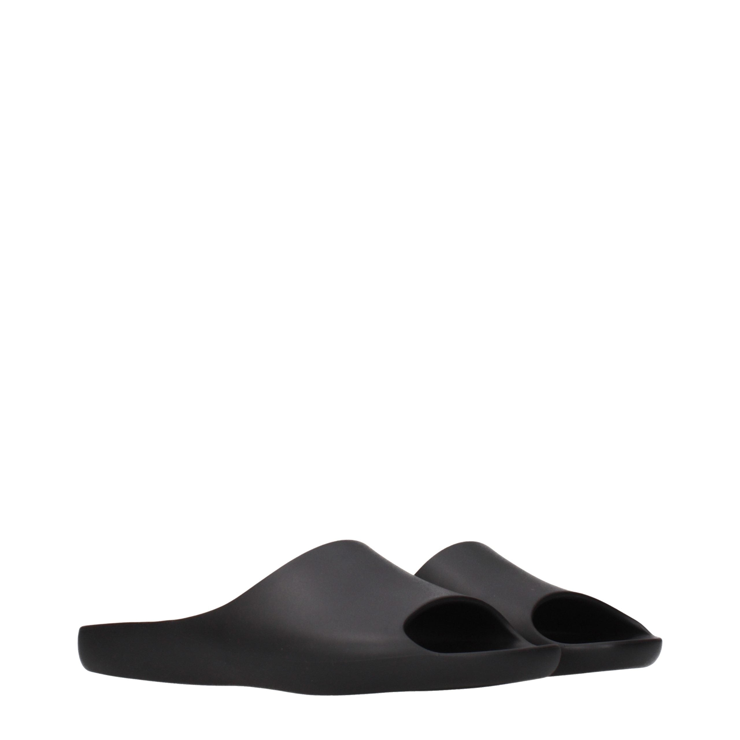 Experience the unparalleled elegance of The Row Black Cotton Slippers, where luxurious craftsmanship meets timeless design, perfect for elevating your everyday moments.