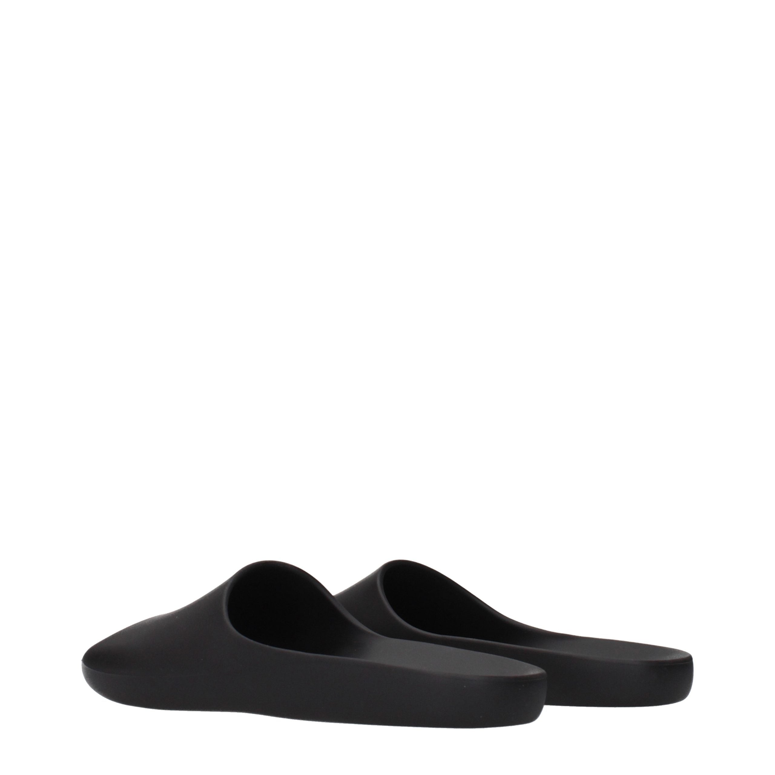 Experience the sublime elegance of The Row Black Cotton Slippers, where luxurious craftsmanship meets timeless design for effortless sophistication in every moment.