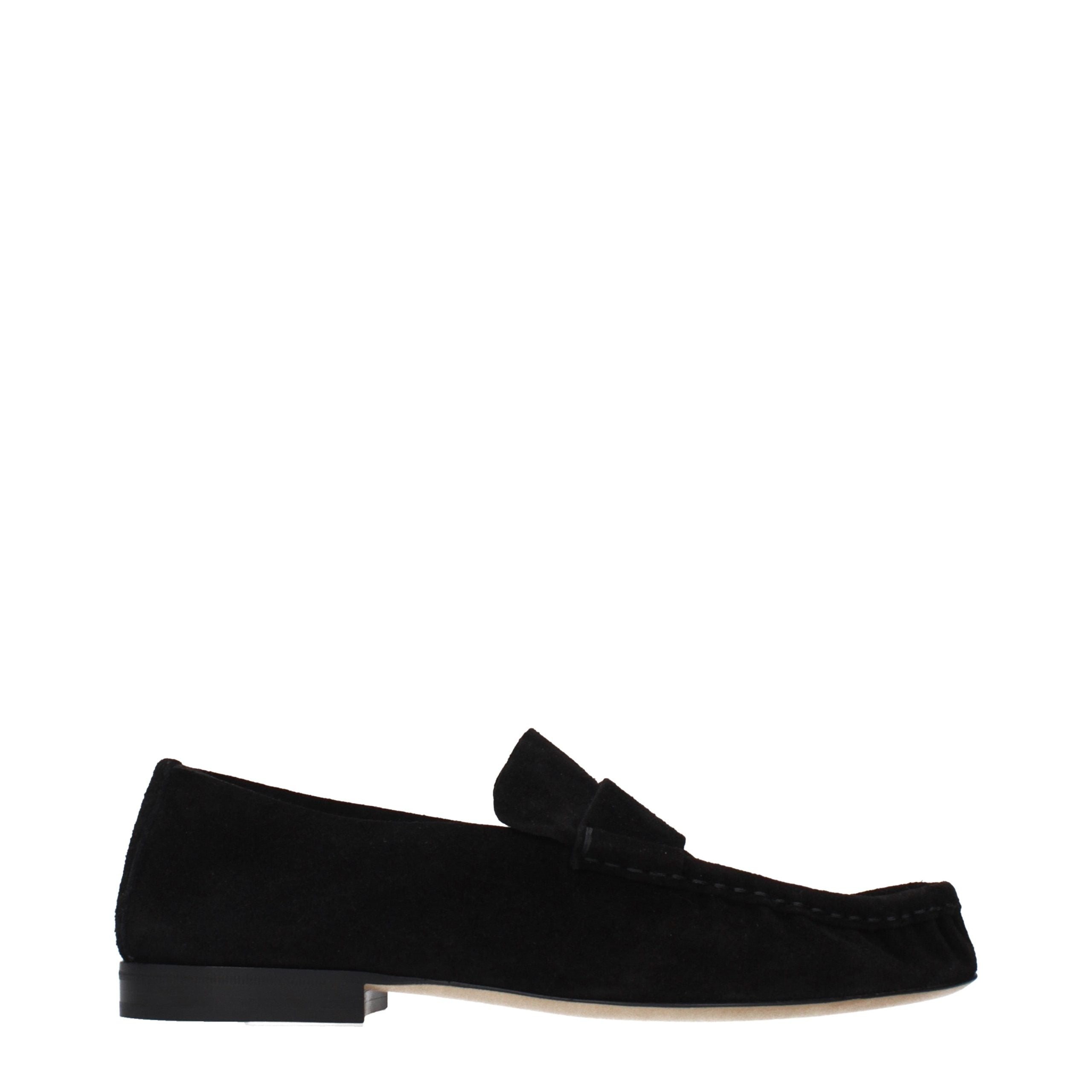 Experience the epitome of elegance with The Row Black Leather Slip-On Loafers, where exquisite craftsmanship meets timeless sophistication for the discerning individual.