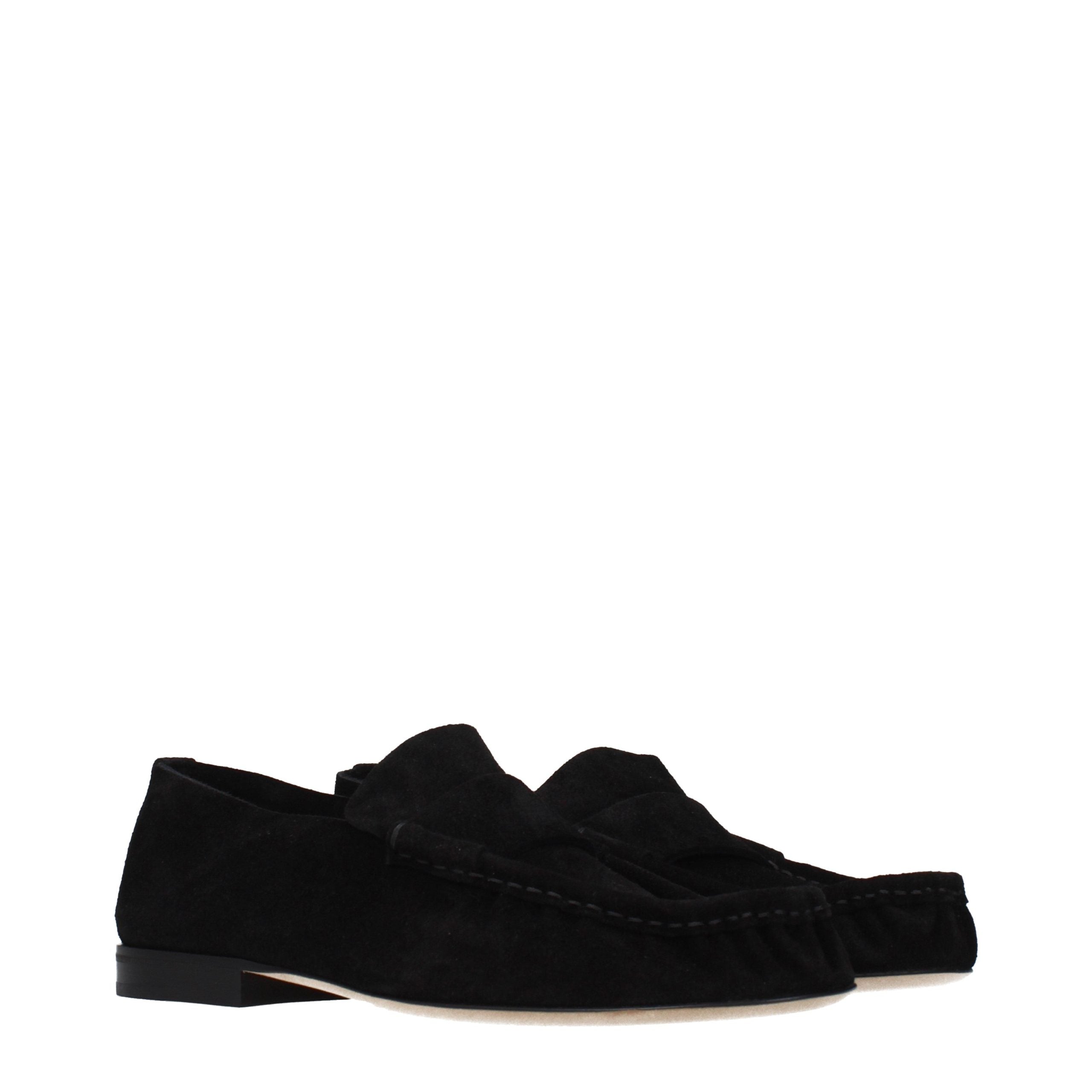 Experience the exquisite allure of The Row Black Leather Slip-On Loafers, where timeless elegance meets unparalleled craftsmanship, perfect for the discerning individual.