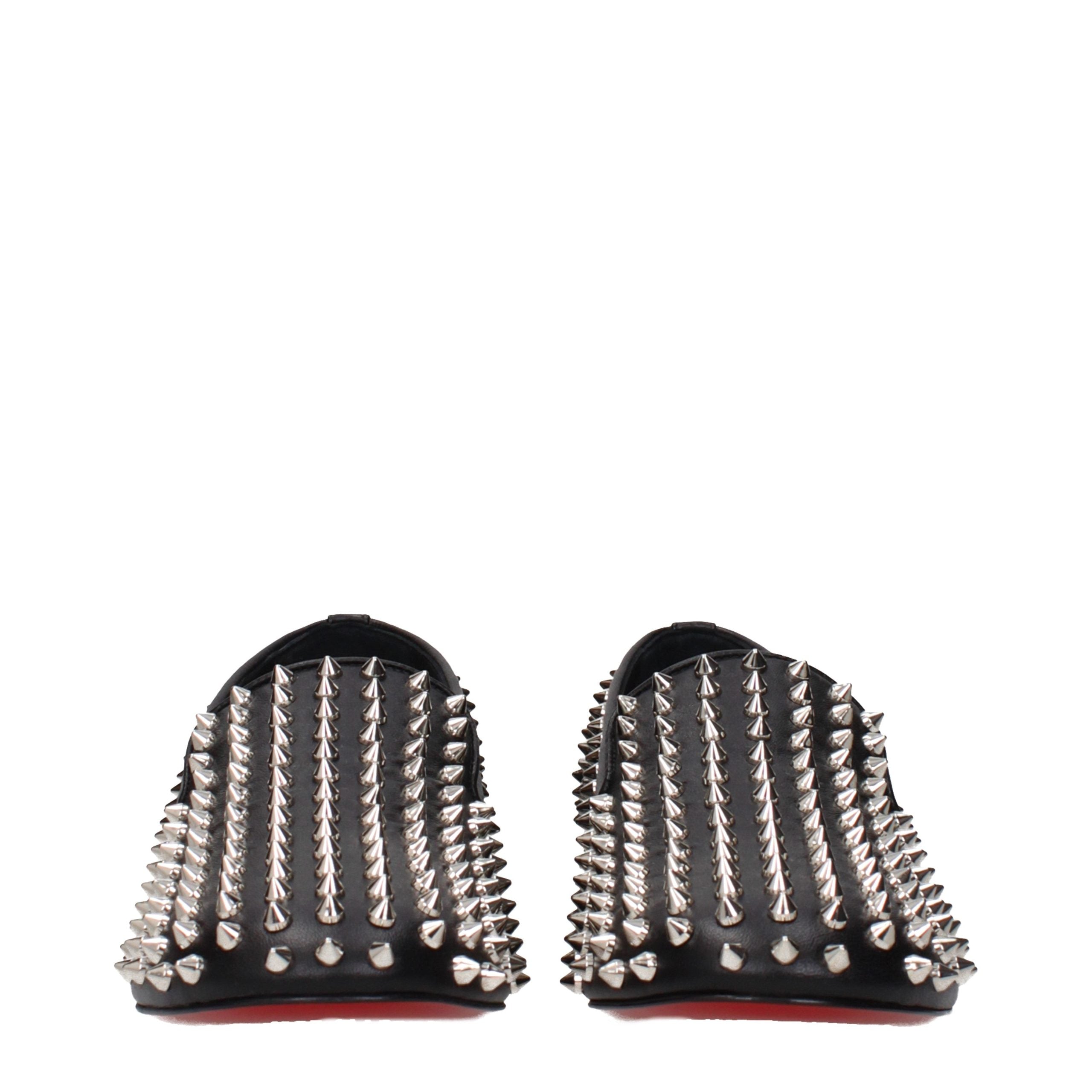 Step into the realm of luxury with Christian Louboutin Black Leather Slip-On Loafers, where exquisite craftsmanship meets modern elegance, perfect for the discerning individual.