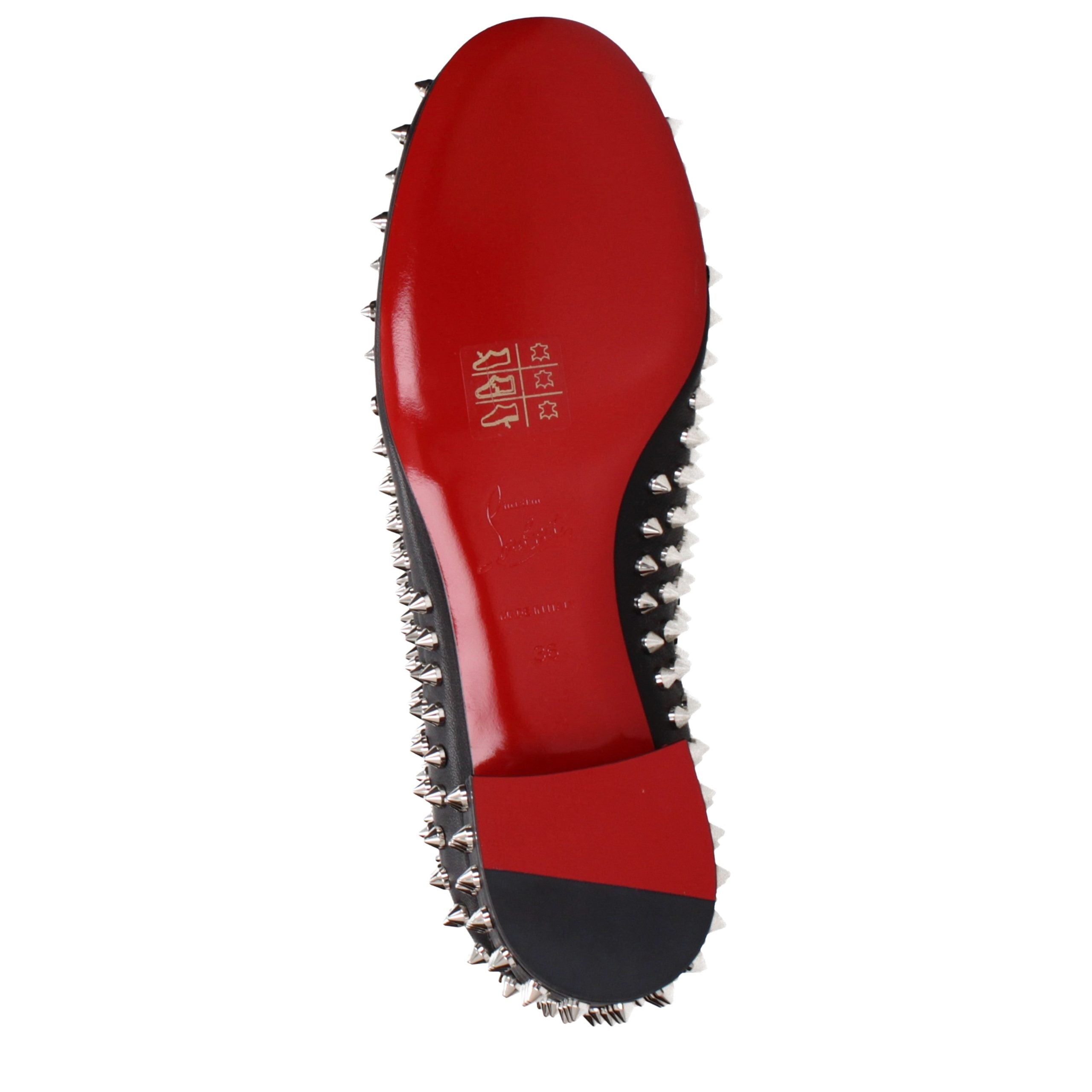 Experience the allure of Christian Louboutin Black Leather Slip-On Loafers, where exquisite craftsmanship meets modern elegance, embodying luxury for the discerning individual.